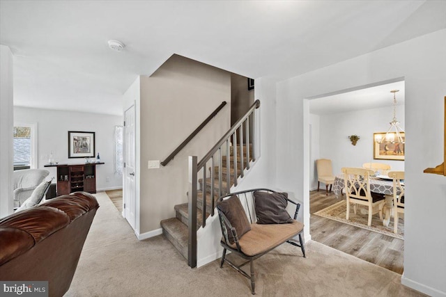 228 Cranberry Dr, Blakeslee, PA 18610 - stairs with baseboards and a chandelier