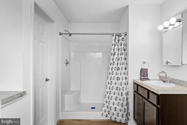 228 Cranberry Dr, Blakeslee, PA 18610 - full bath featuring vanity, curtained shower, and wood finished floors