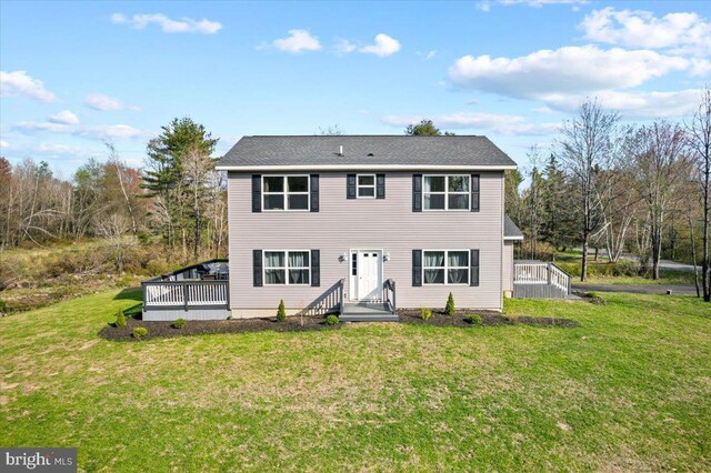 228 Cranberry Dr, Blakeslee, PA 18610 - view of front facade featuring a front yard and a wooden deck