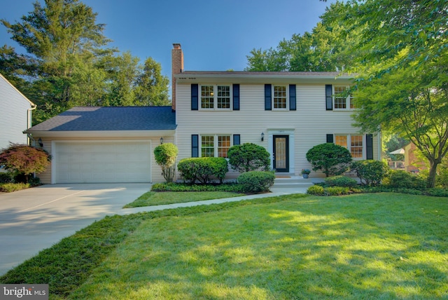 12013 Cheviot Dr, Herndon, VA 20170 - colonial-style house featuring a chimney, a garage, concrete driveway, and a front yard