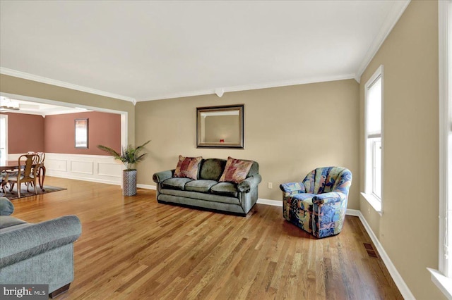 17 N Carolina Ave, Reading, PA 19608 - living room with wood finished floors, ornamental molding, and healthy amount of natural light