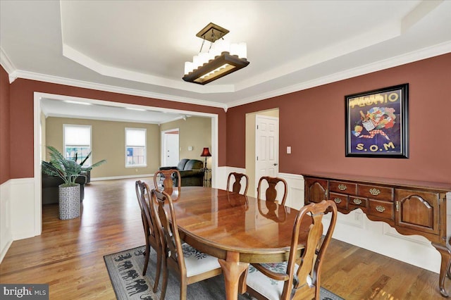 17 N Carolina Ave, Reading, PA 19608 - dining room with a tray ceiling, light wood-style floors, and crown molding