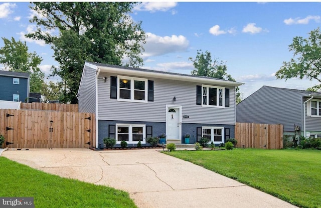 6715 Valley Park Rd, Capitol Heights, MD 20743 - bi-level home with brick siding and a gate