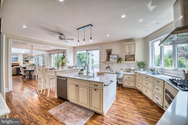 6153 Long Point Rd, Neavitt, MD 21652 - kitchen with cream cabinetry, appliances with stainless steel finishes, wall chimney range hood, a sink, and open shelves