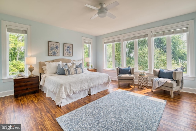 6153 Long Point Rd, Neavitt, MD 21652 - bedroom featuring multiple windows, baseboards, and wood finished floors