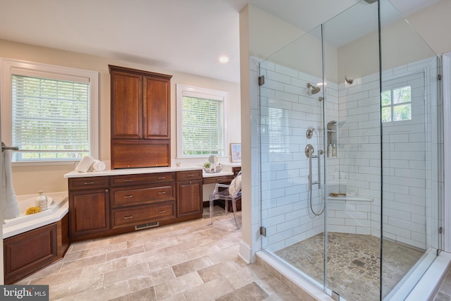 6153 Long Point Rd, Neavitt, MD 21652 - full bathroom featuring a shower stall, healthy amount of natural light, vanity, and a tub to relax in