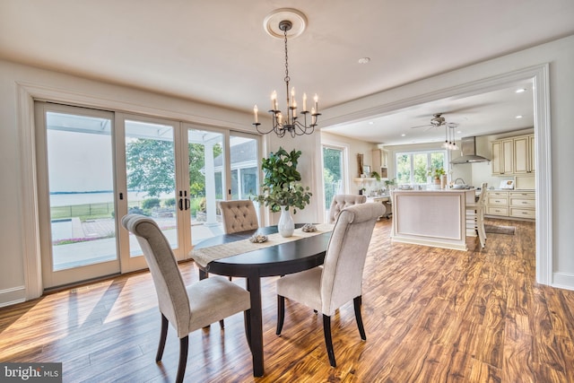 6153 Long Point Rd, Neavitt, MD 21652 - dining room featuring wood finished floors, a chandelier, recessed lighting, french doors, and ceiling fan