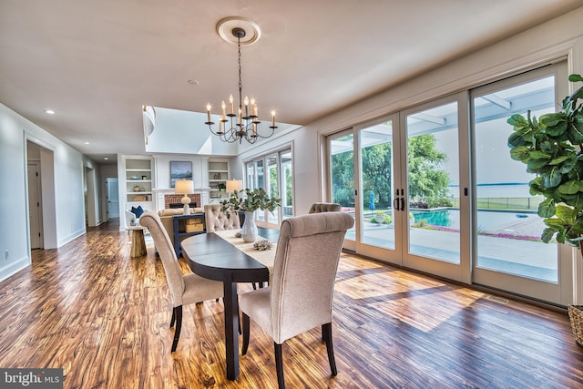 6153 Long Point Rd, Neavitt, MD 21652 - dining room with wood finished floors, french doors, a chandelier, recessed lighting, and baseboards