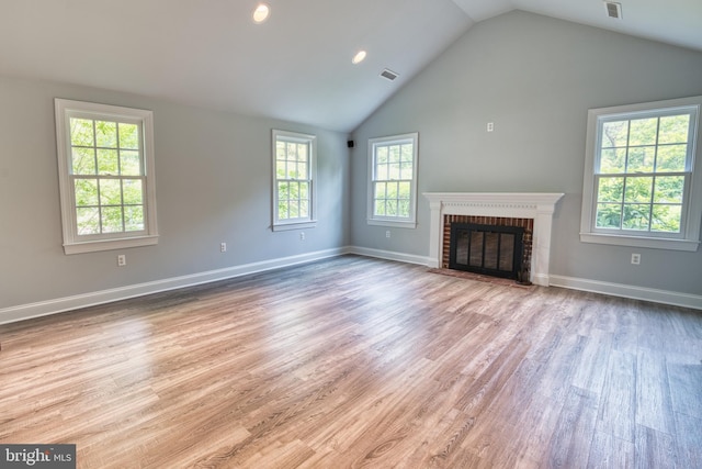 6153 Long Point Rd, Neavitt, MD 21652 - unfurnished living room featuring wood finished floors, lofted ceiling, a brick fireplace, recessed lighting, and baseboards