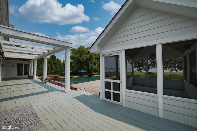 6153 Long Point Rd, Neavitt, MD 21652 - deck featuring a sunroom and an outdoor pool