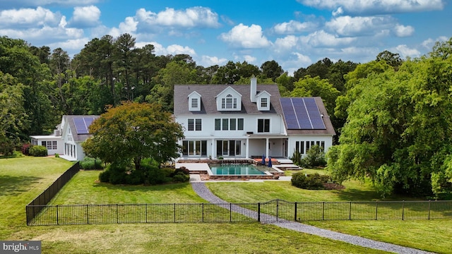 6153 Long Point Rd, Neavitt, MD 21652 - back of property with roof mounted solar panels, an outdoor pool, and a chimney
