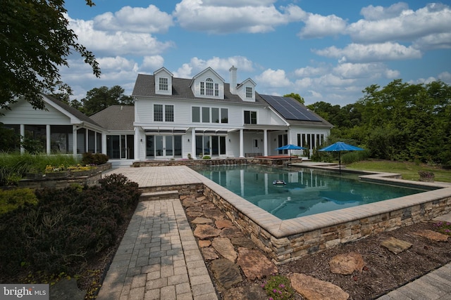 6153 Long Point Rd, Neavitt, MD 21652 - outdoor pool with a patio, a sunroom, and french doors