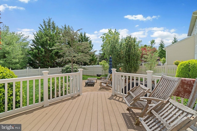 5631 Jordan Blvd, New Market, MD 21774 - wooden deck featuring a fire pit and a fenced backyard