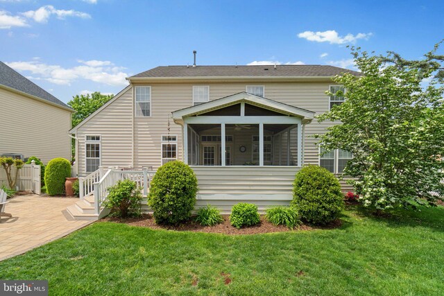 5631 Jordan Blvd, New Market, MD 21774 - back of property with a sunroom, a lawn, a patio, and a deck
