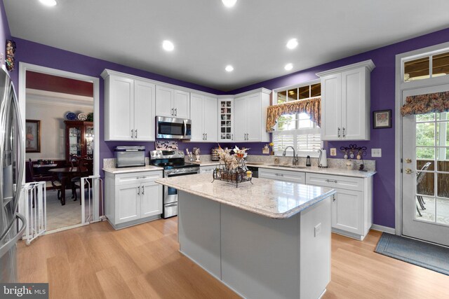 5631 Jordan Blvd, New Market, MD 21774 - kitchen featuring appliances with stainless steel finishes, a sink, light wood-style floors, white cabinets, and recessed lighting
