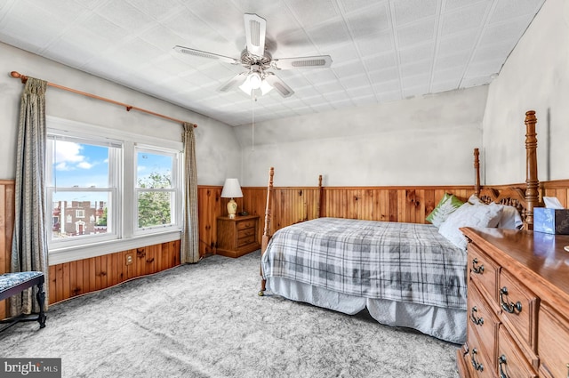 2942 Oley Turnpike Rd, Reading, PA 19606 - carpeted bedroom with a wainscoted wall, a ceiling fan, and wood walls