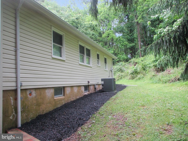 13 Pinyon Pine Cir, Wilmington, DE 19808 - view of property exterior with a yard and central air condition unit