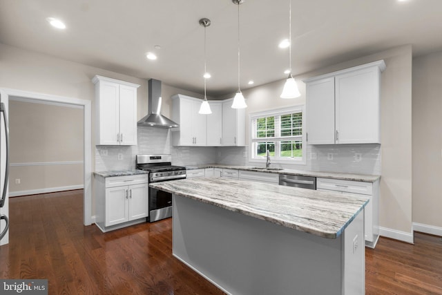 766 Chatelaine Ct, Eldersburg, MD 21784 - kitchen with wall chimney range hood, stainless steel appliances, white cabinetry, a kitchen island, and tasteful backsplash