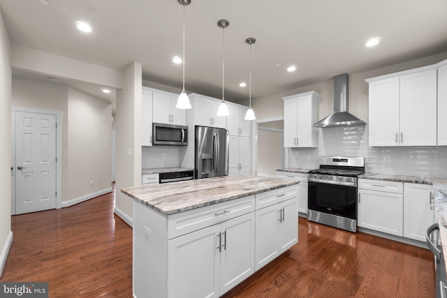 766 Chatelaine Ct, Eldersburg, MD 21784 - kitchen featuring appliances with stainless steel finishes, wall chimney range hood, a center island, tasteful backsplash, and dark wood finished floors