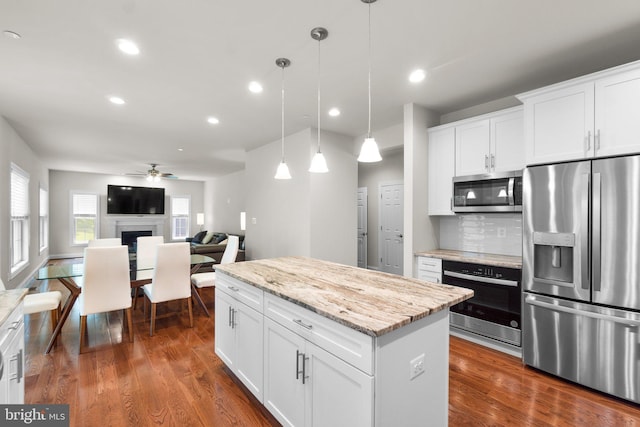 766 Chatelaine Ct, Eldersburg, MD 21784 - kitchen with stainless steel appliances, a ceiling fan, dark wood-style floors, recessed lighting, and a center island