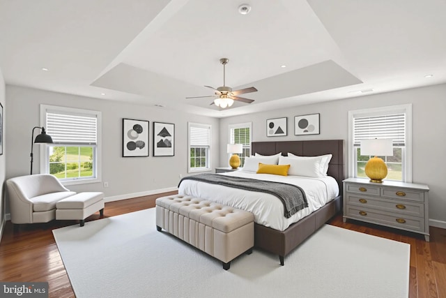 766 Chatelaine Ct, Eldersburg, MD 21784 - bedroom featuring a tray ceiling, dark wood-style floors, and a ceiling fan