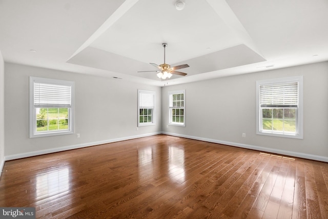 766 Chatelaine Ct, Eldersburg, MD 21784 - empty room featuring a tray ceiling, a smoke detector, wood finished floors, and a ceiling fan