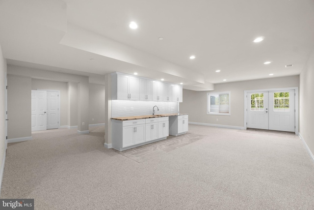 766 Chatelaine Ct, Eldersburg, MD 21784 - kitchen with recessed lighting, light carpet, white cabinetry, open floor plan, and tasteful backsplash