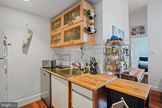 1413 Hopkins St NW, Washington, DC 20036 - kitchen with dark wood-style flooring, wood counters, and a sink
