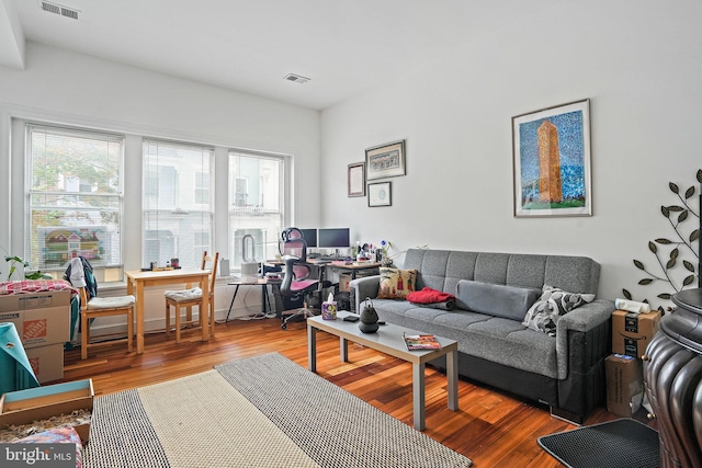 1413 Hopkins St NW, Washington, DC 20036 - living area with a desk, plenty of natural light, and wood finished floors