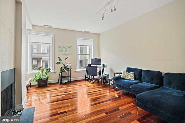 1413 Hopkins St NW, Washington, DC 20036 - living area featuring wood finished floors, a fireplace with flush hearth, and baseboards