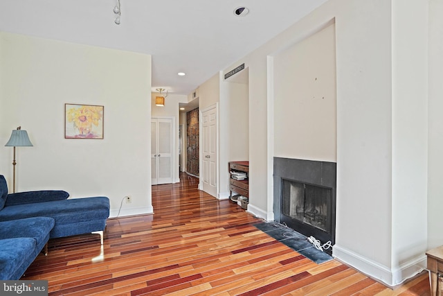 1413 Hopkins St NW, Washington, DC 20036 - living room featuring wood finished floors, a tile fireplace, baseboards, and recessed lighting
