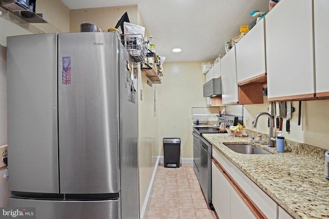 1413 Hopkins St NW, Washington, DC 20036 - kitchen featuring freestanding refrigerator, a sink, range, light tile patterned flooring, and white cabinets