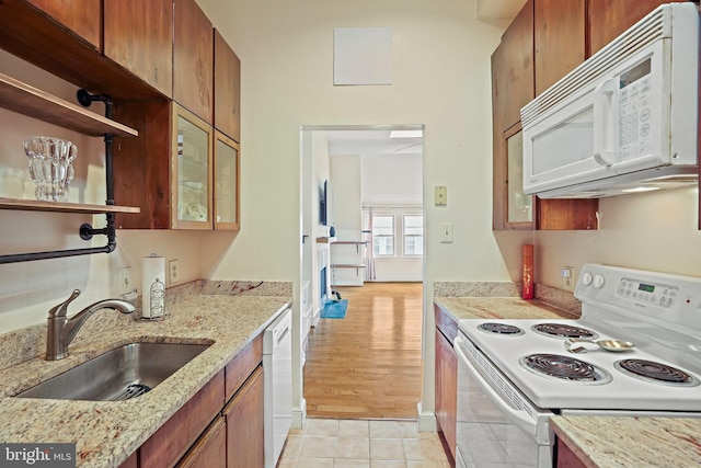 1413 Hopkins St NW, Washington, DC 20036 - kitchen featuring white appliances, a sink, glass insert cabinets, light tile patterned floors, and open shelves