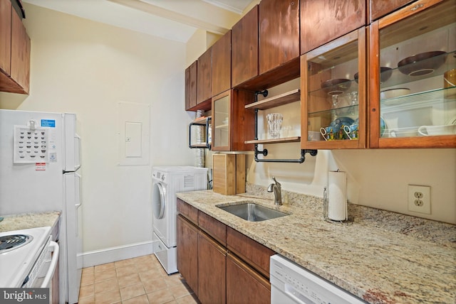 1413 Hopkins St NW, Washington, DC 20036 - kitchen with a sink, washer / clothes dryer, electric panel, light tile patterned flooring, and light stone countertops