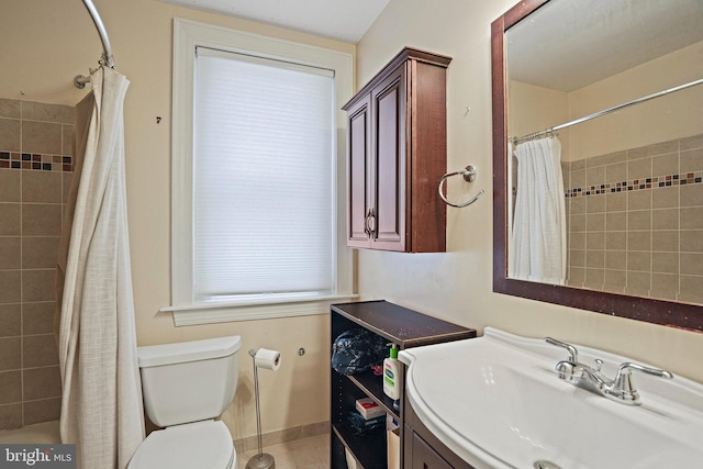 1413 Hopkins St NW, Washington, DC 20036 - bathroom featuring vanity, toilet, tile patterned flooring, and shower / bath combination with curtain