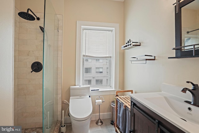 1413 Hopkins St NW, Washington, DC 20036 - bathroom featuring toilet, a tile shower, vanity, and baseboards