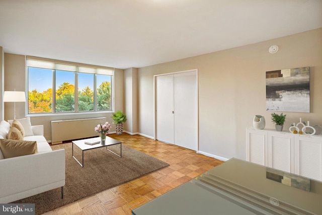 2939 Van Ness St NW Unit 1144, Washington, DC 20008 - living room featuring radiator and baseboards