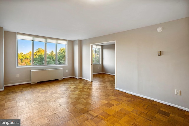 2939 Van Ness St NW Unit 1144, Washington, DC 20008 - empty room with radiator, baseboards, and a smoke detector