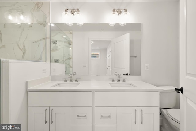 4335 Harrison St NW Unit 2, Washington, DC 20015 - full bathroom featuring double vanity, toilet, and a marble finish shower