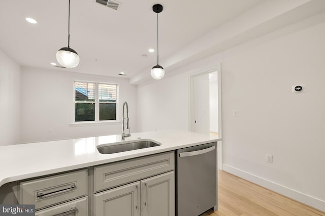 4335 Harrison St NW Unit 2, Washington, DC 20015 - kitchen featuring stainless steel dishwasher, a sink, light wood finished floors, pendant lighting, and recessed lighting