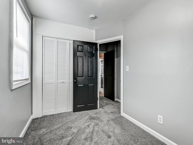 3812 Midheights Rd, Baltimore, MD 21215 - unfurnished bedroom with carpet, baseboards, and a closet