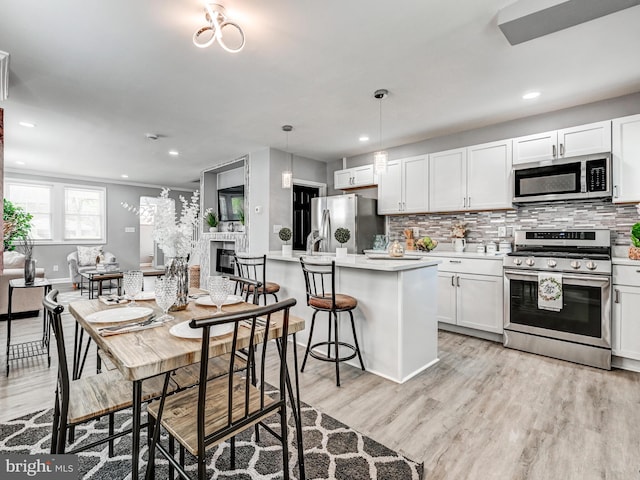 3812 Midheights Rd, Baltimore, MD 21215 - dining room with light wood-style floors, recessed lighting, and baseboards