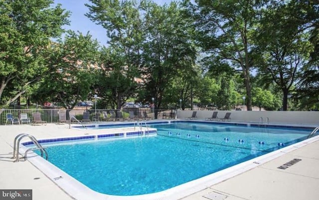 1300 Army Navy Dr Unit 803, Arlington, VA 22202 - community pool featuring a patio area
