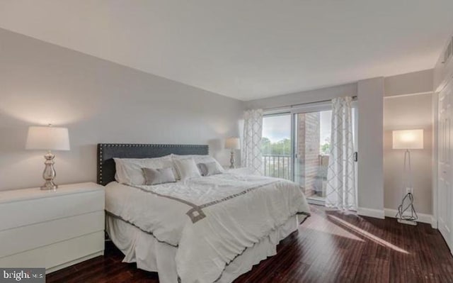 1300 Army Navy Dr Unit 803, Arlington, VA 22202 - bedroom with access to exterior, dark wood-style floors, and baseboards