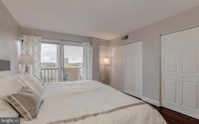 1300 Army Navy Dr Unit 803, Arlington, VA 22202 - bedroom featuring access to exterior, dark wood-style floors, and baseboards
