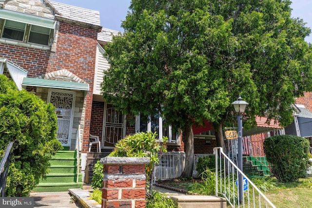 8627 Gilbert St, Philadelphia, PA 19150 - view of front facade featuring brick siding and stairs