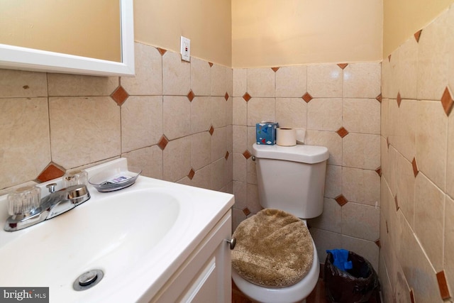 8627 Gilbert St, Philadelphia, PA 19150 - bathroom featuring tile walls, vanity, and toilet