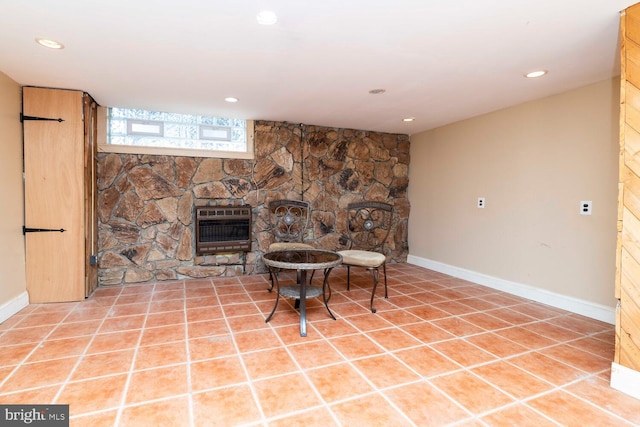 8627 Gilbert St, Philadelphia, PA 19150 - sitting room featuring heating unit, a fireplace, recessed lighting, light tile patterned floors, and baseboards