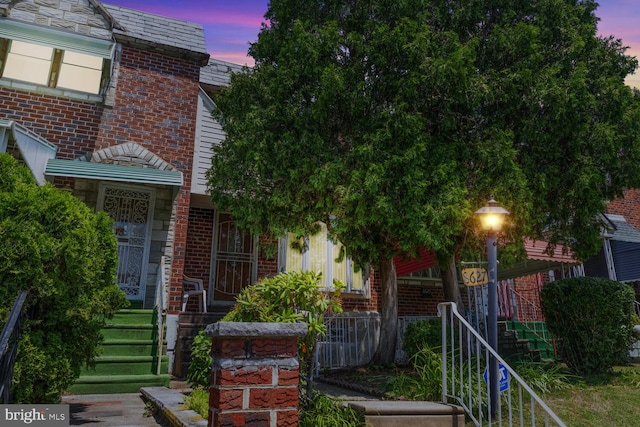 8627 Gilbert St, Philadelphia, PA 19150 - view of front of house with brick siding and stairway