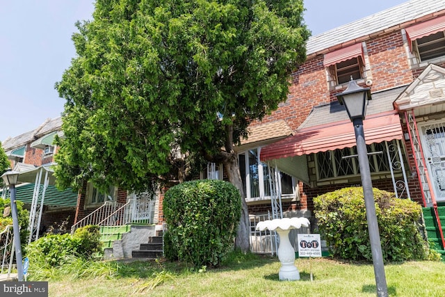 8627 Gilbert St, Philadelphia, PA 19150 - view of front facade featuring brick siding